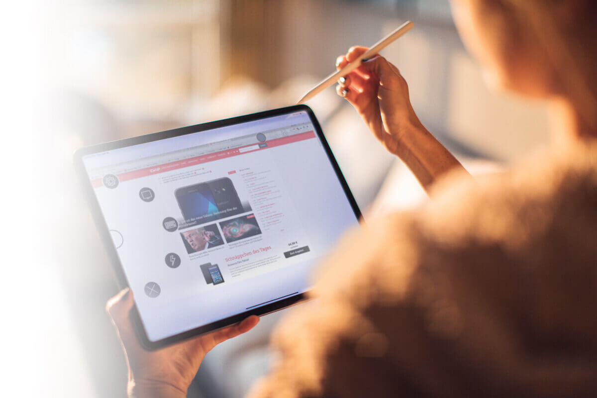 Woman working on a tablet with a pen